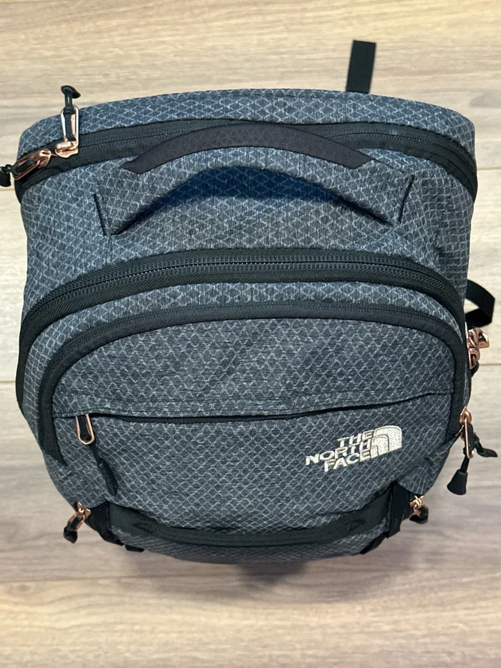The North Face Surge Backpack in TNF Black Heather Copper/TNF Black
